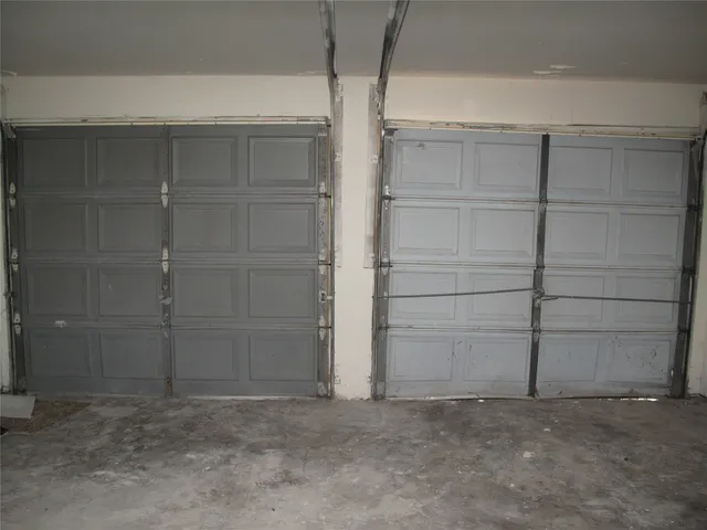 a view of a backyard with a large tree