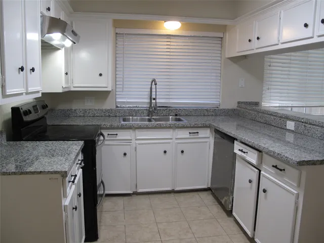 a large kitchen with a stove