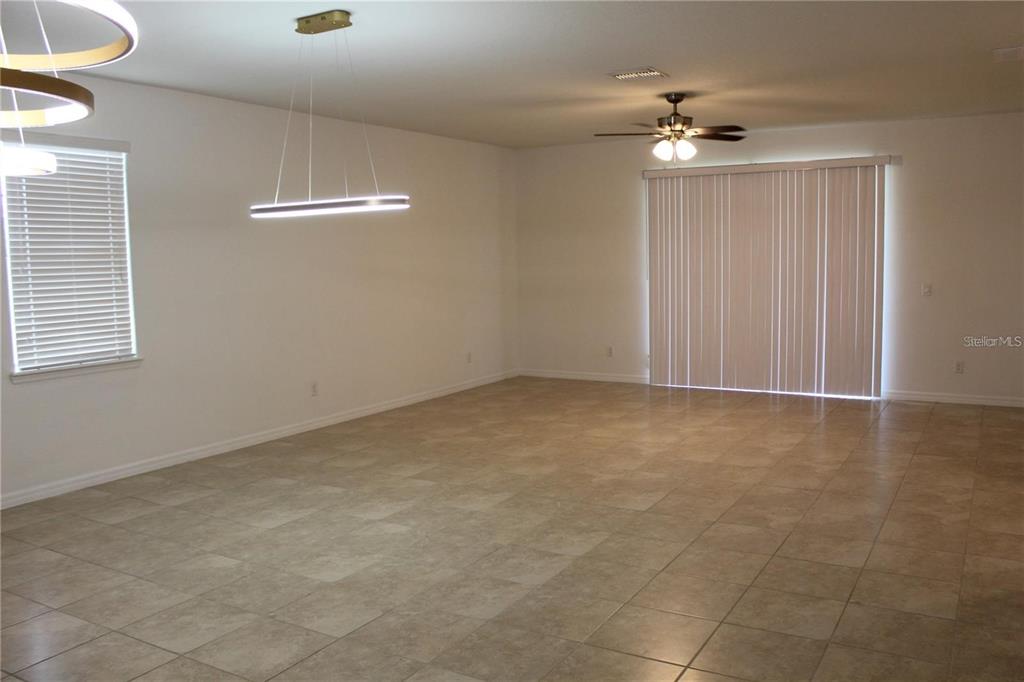 17249 Goldcrest Loop Clermont, FL 34714 - Photo 11 of 29 a view of an empty room with a chandelier fan
