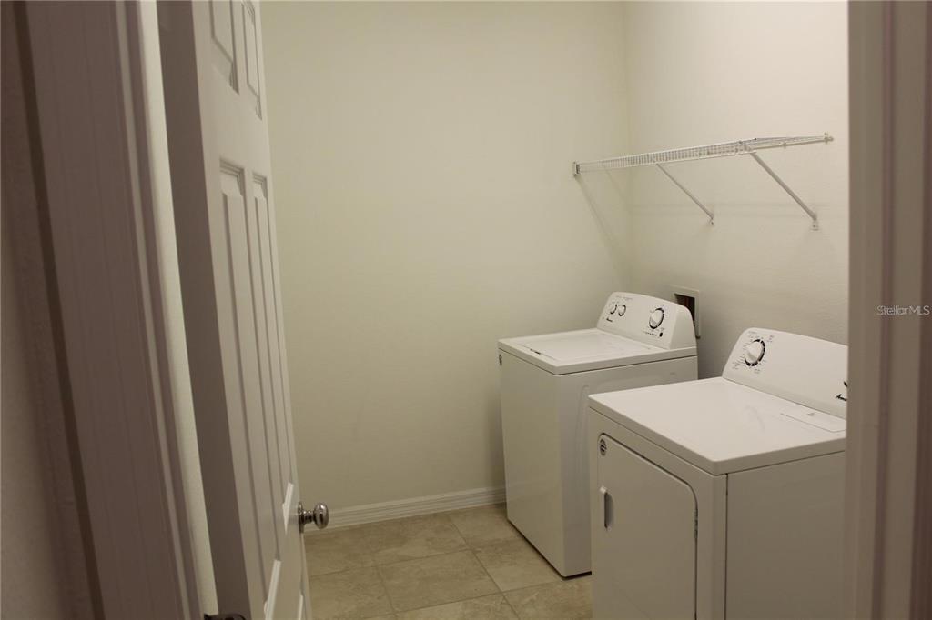 17249 Goldcrest Loop Clermont, FL 34714 - Photo 21 of 29 a utility room with dryer and washer
