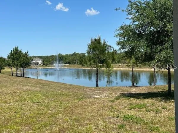 a view of a lake with houses in outdoor space