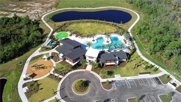 a swimming pool with outdoor seating