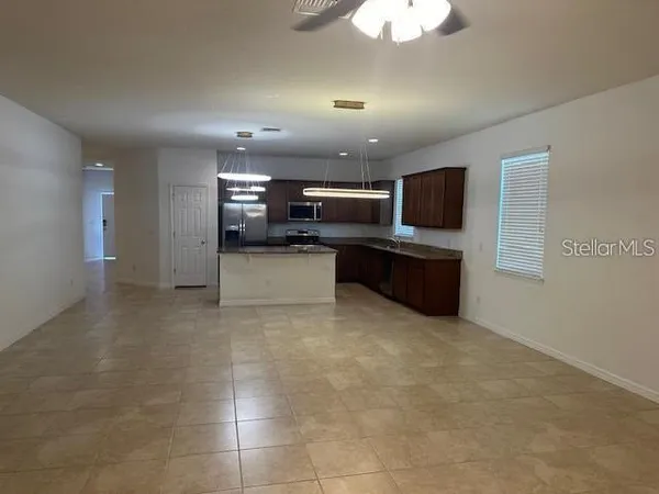 a view of kitchen and microwave