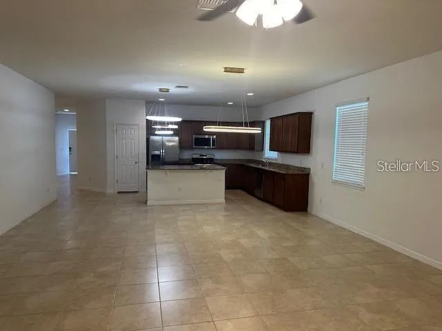 a view of kitchen and microwave