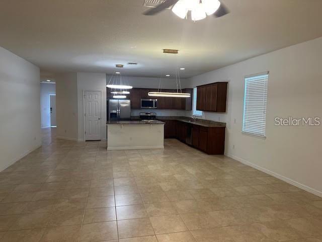 17249 Goldcrest Loop Clermont, FL 34714 - Photo 9 of 29 a view of kitchen and microwave