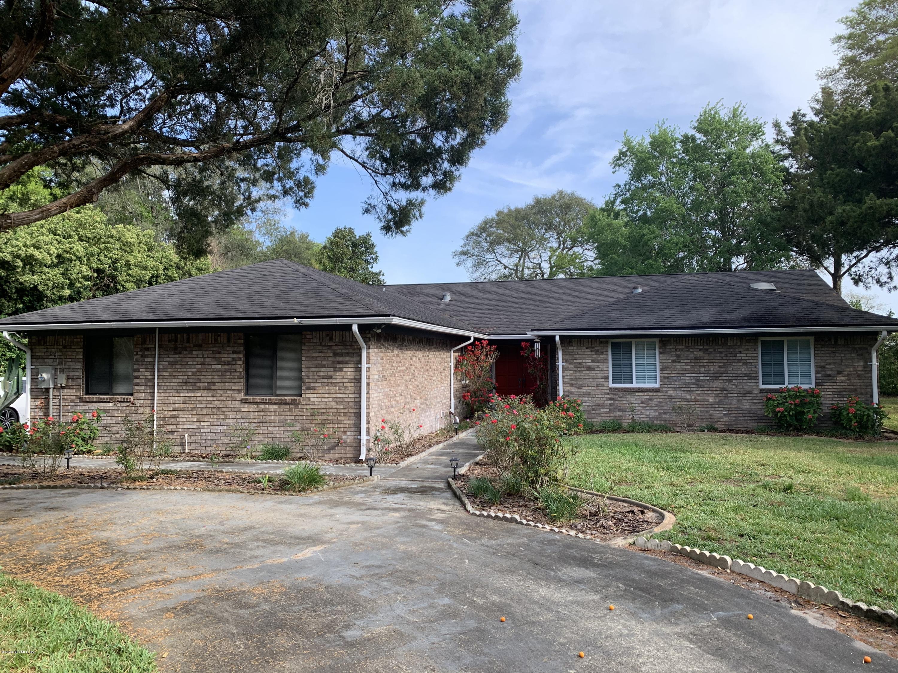 200 Rolling Oaks Road St. Augustine, FL 32086 - Photo 1 of 1 a front view of a house with a yard and garage