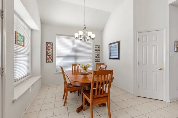 a dining room with furniture and window