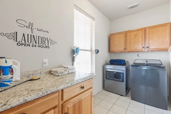 a kitchen with granite countertop a sink and stove top oven