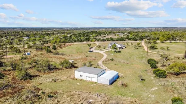an aerial view of residential house with beach
