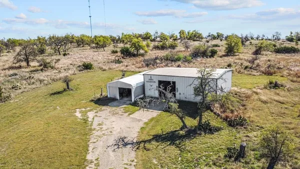 a view of a swimming pool with a yard