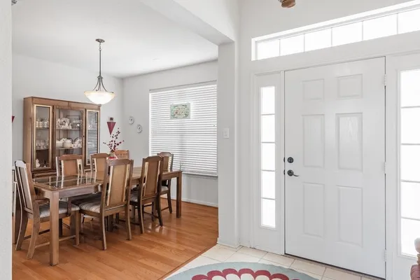 a view of a dining room with furniture window and wooden floor