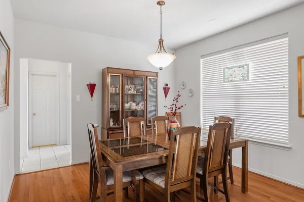 a dining room with furniture and window