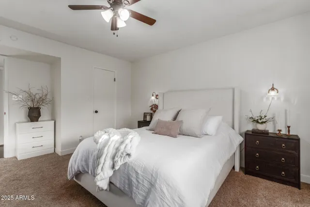 a bedroom with a bed and a dresser