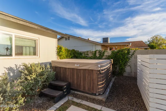 a view of a backyard with sitting area