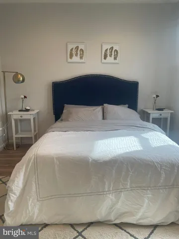 a white toilet sitting next to a bath tub