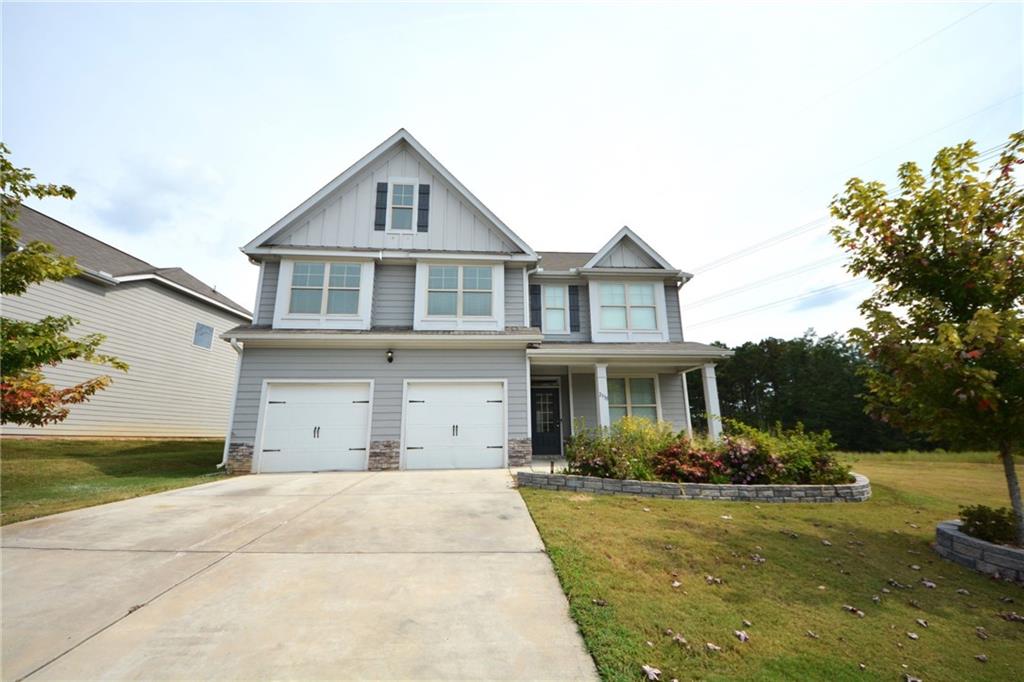 2330 Haliard Way Lithonia, GA 30058 - Photo 1 of 38 a front view of a house with a yard