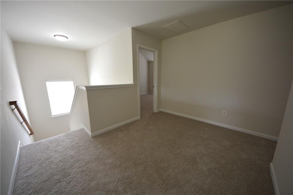 2330 Haliard Way Lithonia, GA 30058 - Photo 26 of 38 an empty room with windows