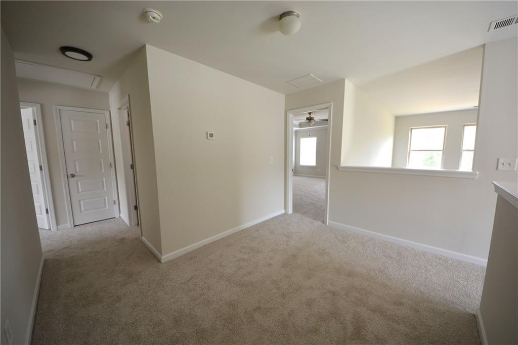 2330 Haliard Way Lithonia, GA 30058 - Photo 27 of 38 wooden floor and windows in a room