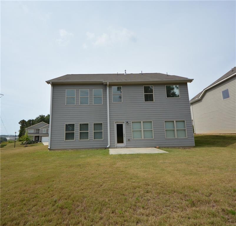 2330 Haliard Way Lithonia, GA 30058 - Photo 4 of 38 a front view of a house with a yard