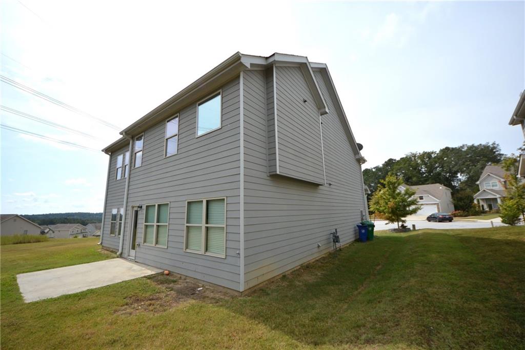 2330 Haliard Way Lithonia, GA 30058 - Photo 5 of 38 a view of a house with a yard
