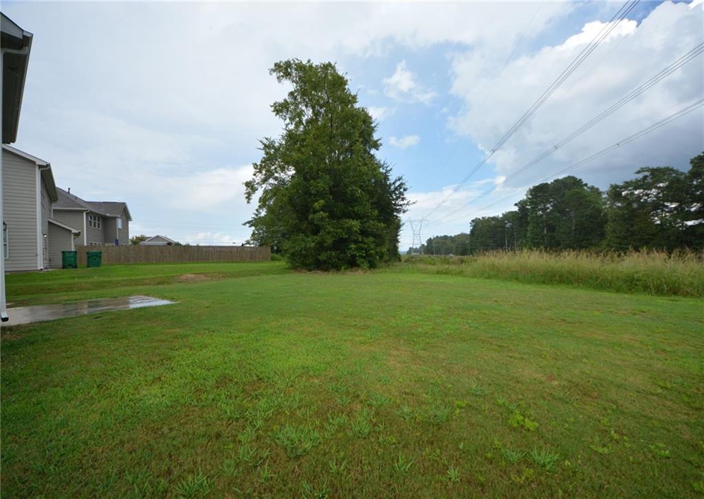 2330 Haliard Way Lithonia, GA 30058 - Photo 6 of 38 a view of a field with an trees