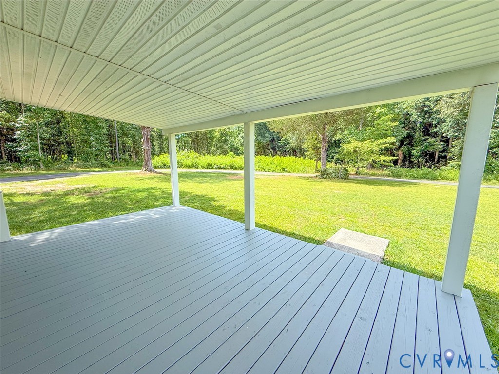 7798 West Courthouse Road Burkeville, VA 23922 - Photo 15 of 23 Covered porch with light gray decking and white su