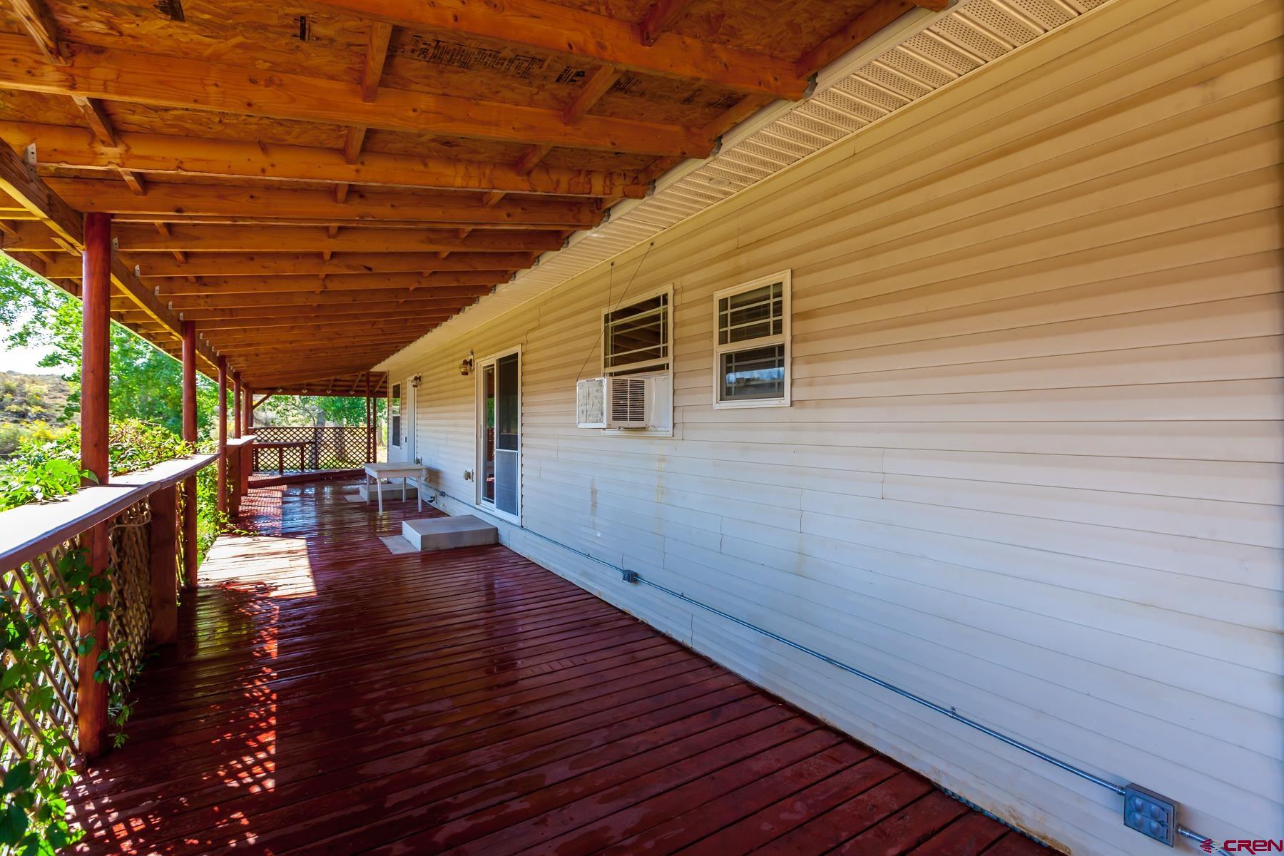 4410 Cedar Road Delta, CO 81416 - Photo 13 of 35 a view of a patio with wooden floor