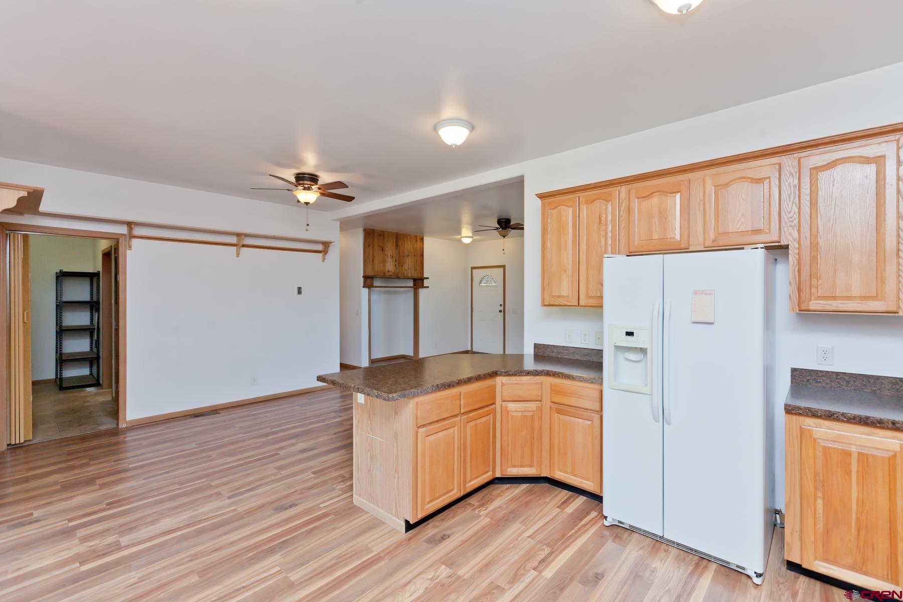 4410 Cedar Road Delta, CO 81416 - Photo 24 of 35 a kitchen with a refrigerator and window