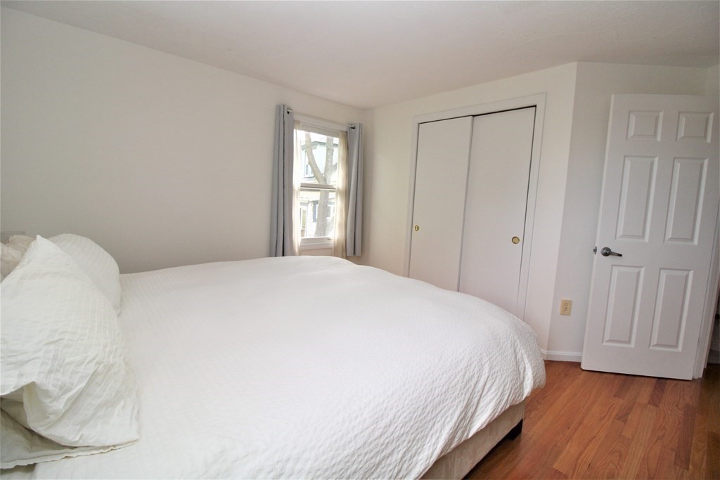 39 Hampstead Road, Unit 1 Boston, MA 02130 - Photo 15 of 29 a spacious bedroom with a bed and a window