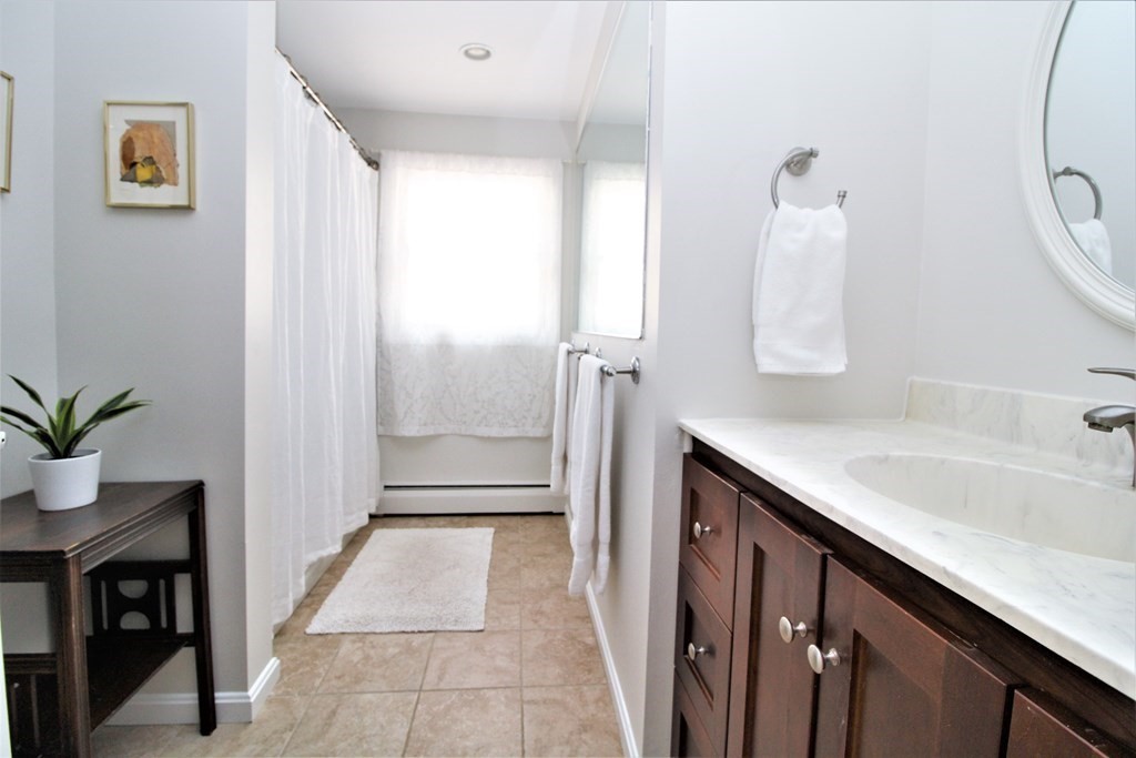 39 Hampstead Road, Unit 1 Boston, MA 02130 - Photo 20 of 29 a bathroom with a sink and a mirror