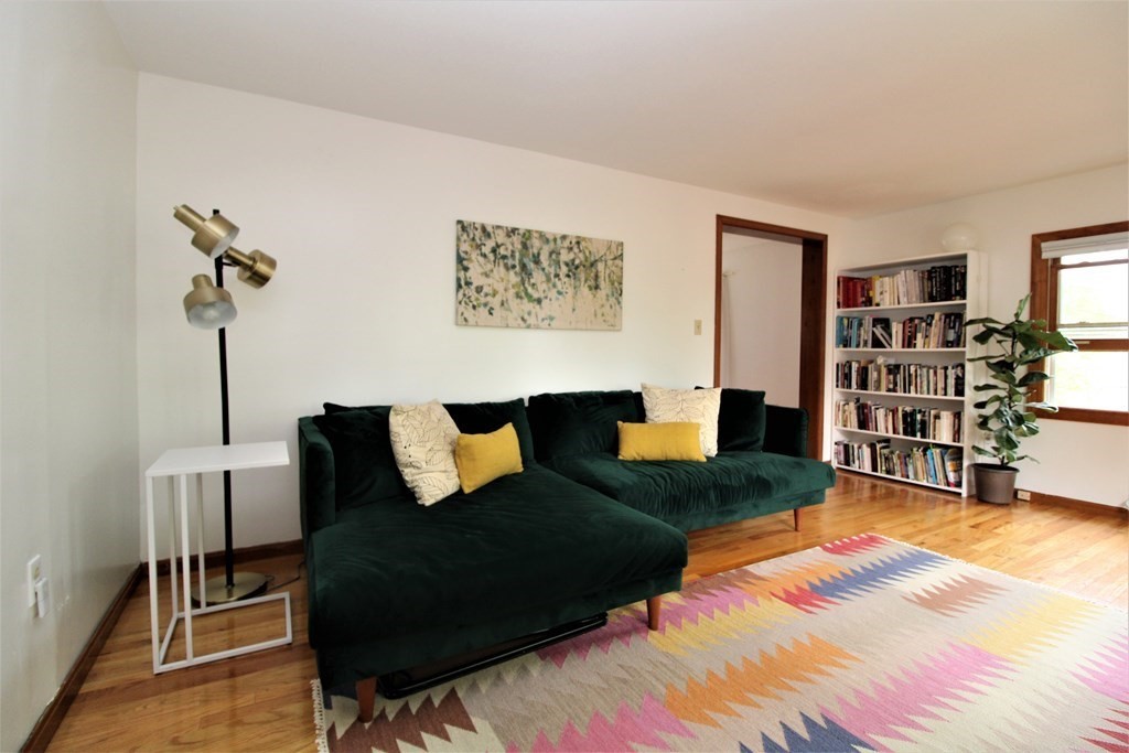 39 Hampstead Road, Unit 1 Boston, MA 02130 - Photo 2 of 29 a living room with furniture and a book shelf