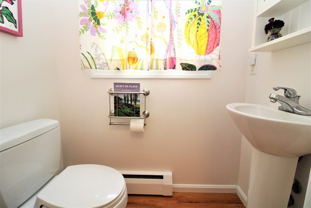 39 Hampstead Road, Unit 1 Boston, MA 02130 - Photo 21 of 29 a bathroom with a sink a toilet and mirror
