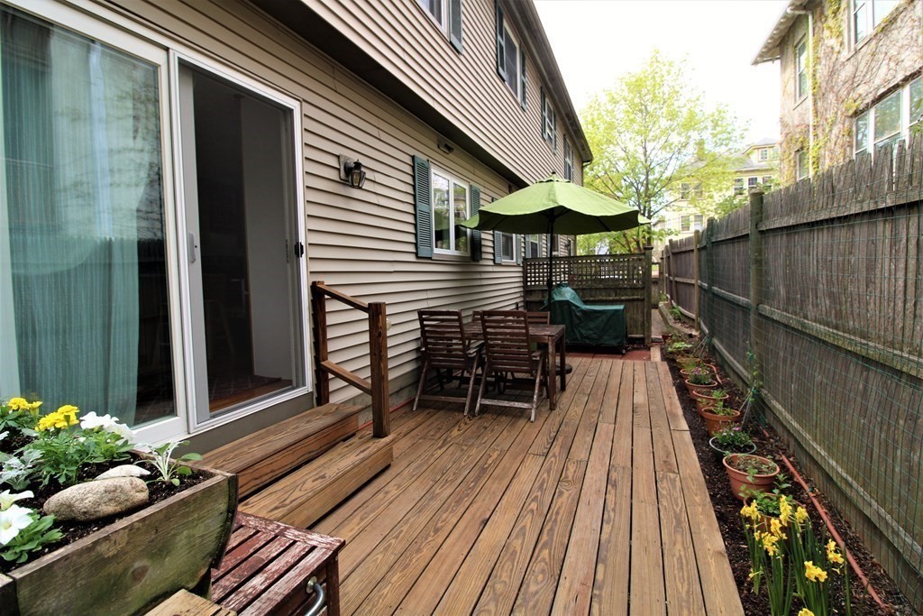 39 Hampstead Road, Unit 1 Boston, MA 02130 - Photo 26 of 29 a balcony with chairs and wooden floor