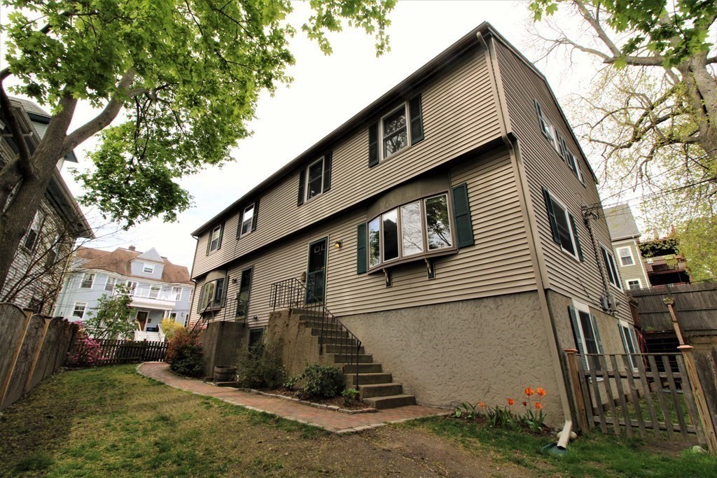 39 Hampstead Road, Unit 1 Boston, MA 02130 - Photo 28 of 29 a view of a house with a yard