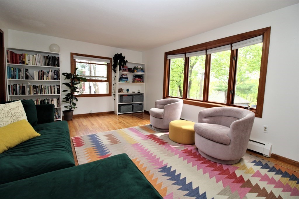 39 Hampstead Road, Unit 1 Boston, MA 02130 - Photo 4 of 29 a living room with furniture and a floor to ceiling window