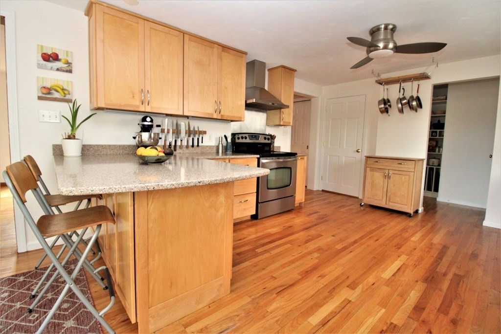 39 Hampstead Road, Unit 1 Boston, MA 02130 - Photo 7 of 29 a kitchen with wooden floors and appliances