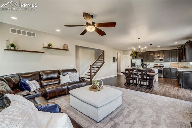 2085 Reed Grass Way Colorado Springs, CO 80915 - Photo 25 of 25 Open concept floor plan with an effortless flow through the living room, dining area, and kitchen