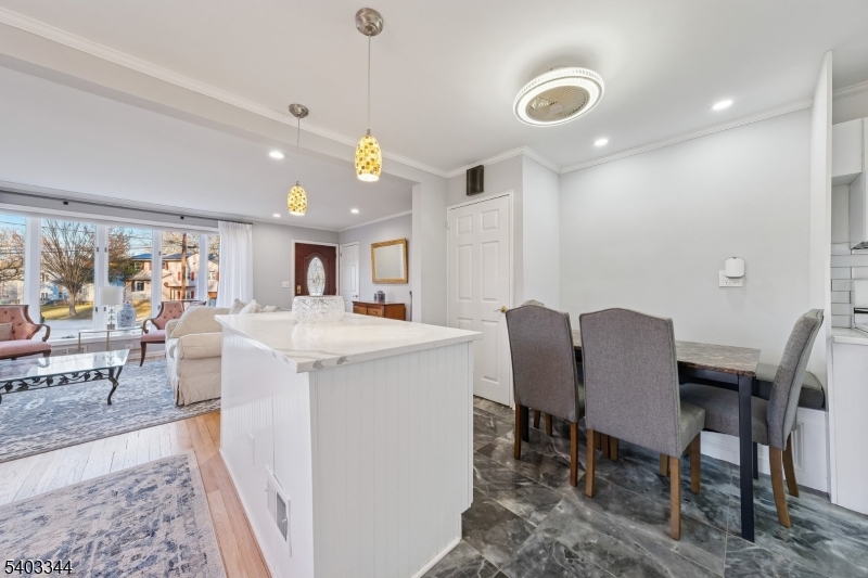651 Amherst Road Linden, NJ 07036 - Photo 12 of 22 a view of a dining room with furniture and a chandelier