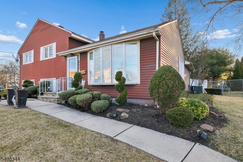 651 Amherst Road Linden, NJ 07036 - Photo 2 of 22 a front view of a house with garden and plants