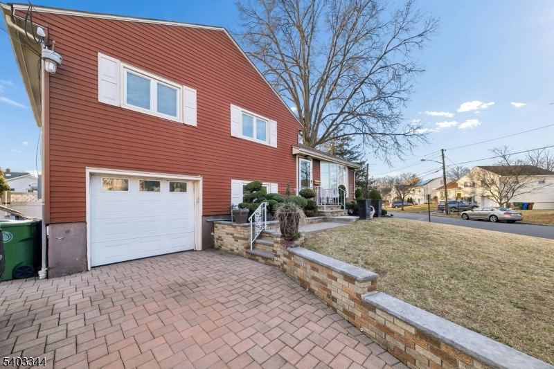651 Amherst Road Linden, NJ 07036 - Photo 3 of 22 a view of a house with a yard and garage