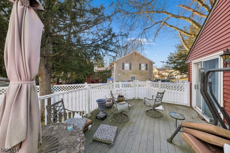 651 Amherst Road Linden, NJ 07036 - Photo 5 of 22 a view of deck with patio table and chairs