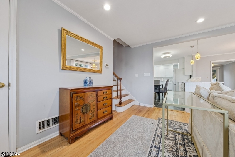 651 Amherst Road Linden, NJ 07036 - Photo 6 of 22 a living room with furniture a wooden floor and next to a window