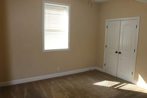 a view of a room that has a window in it