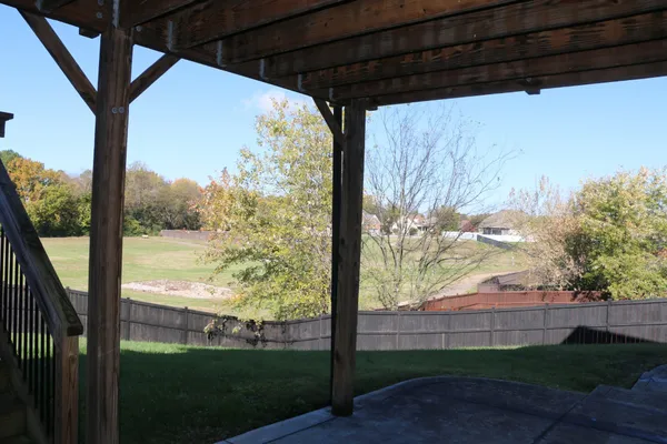 a view of a porch with a yard
