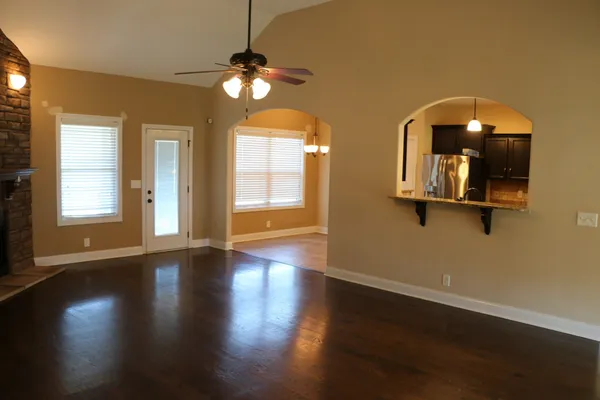 a view of a room with wooden floor