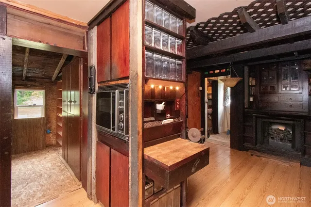 a view of a room that has a fireplace