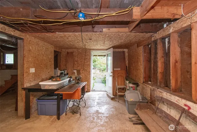 a view of house with backyard and outdoor seating