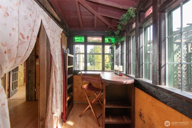 a dining room with a table and chairs