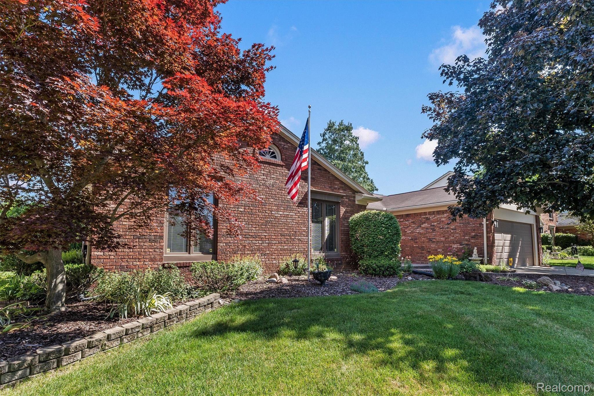 1662 Sumac Drive Rochester, MI 48309 - Photo 2 of 38 Brick exterior with an arched window accent and a prominent front entry