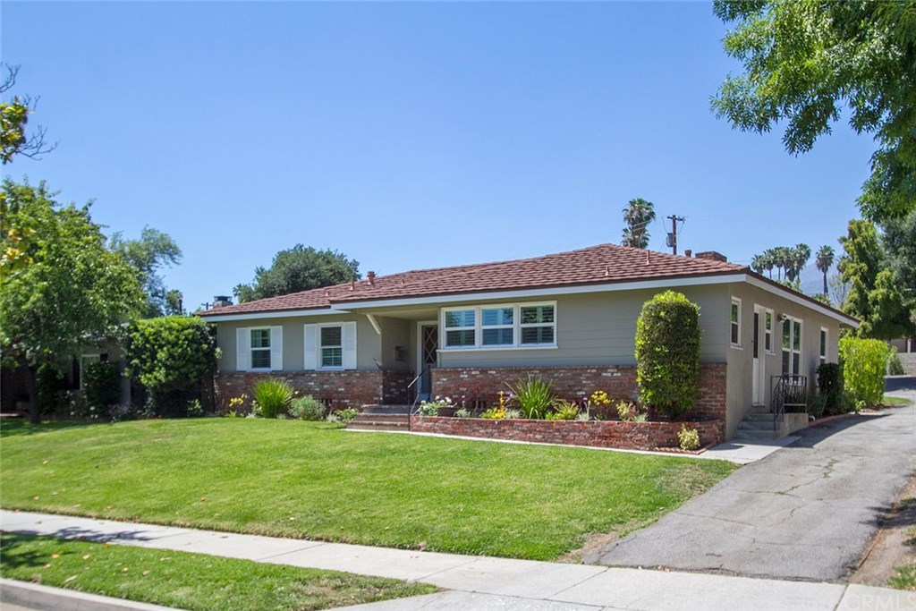 3745 Landfair Road Pasadena, CA 91107 - Photo 2 of 25 a front view of house with yard and green space